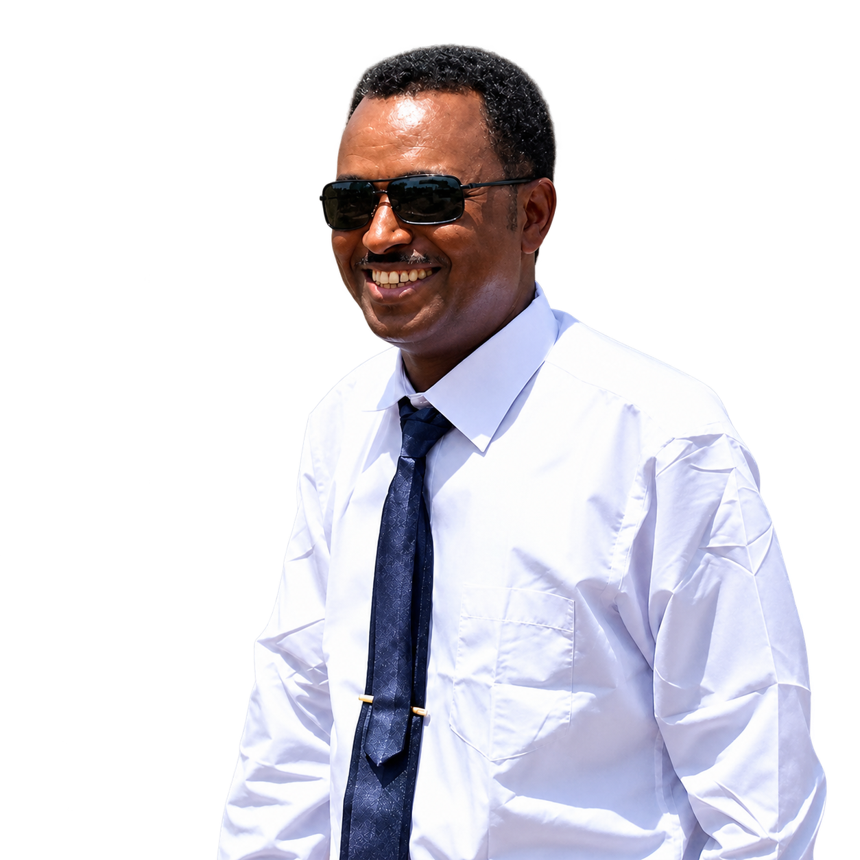 Distinguished professional portrait of CEO Mehari Neguse, Ethiopian male executive leader in dark navy suit with an engineering site and construction blueprints in soft background focus, symbolizing authoritative infrastructure leadership.