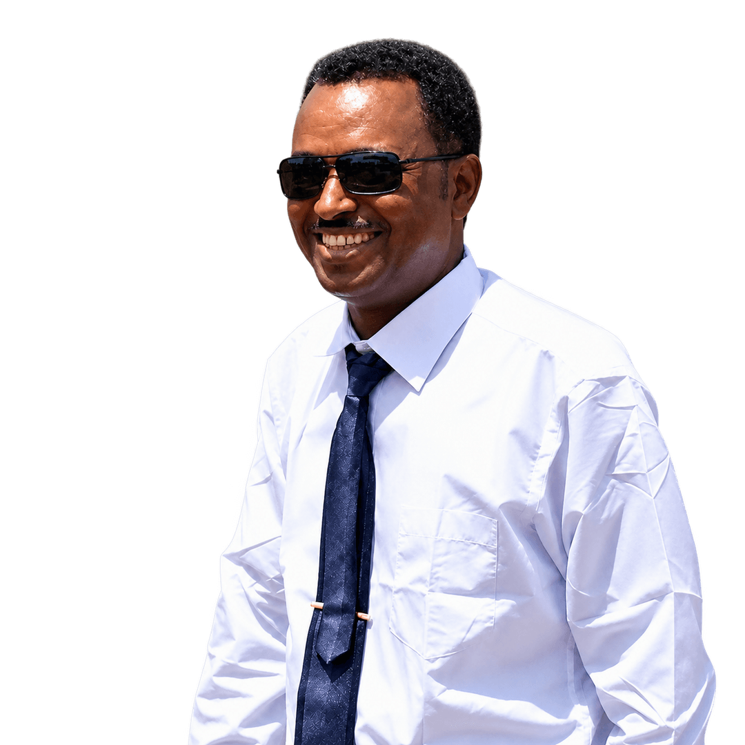 Distinguished professional portrait of CEO Mehari Neguse, Ethiopian male executive leader in dark navy suit with an engineering site and construction blueprints in soft background focus, symbolizing authoritative infrastructure leadership.
